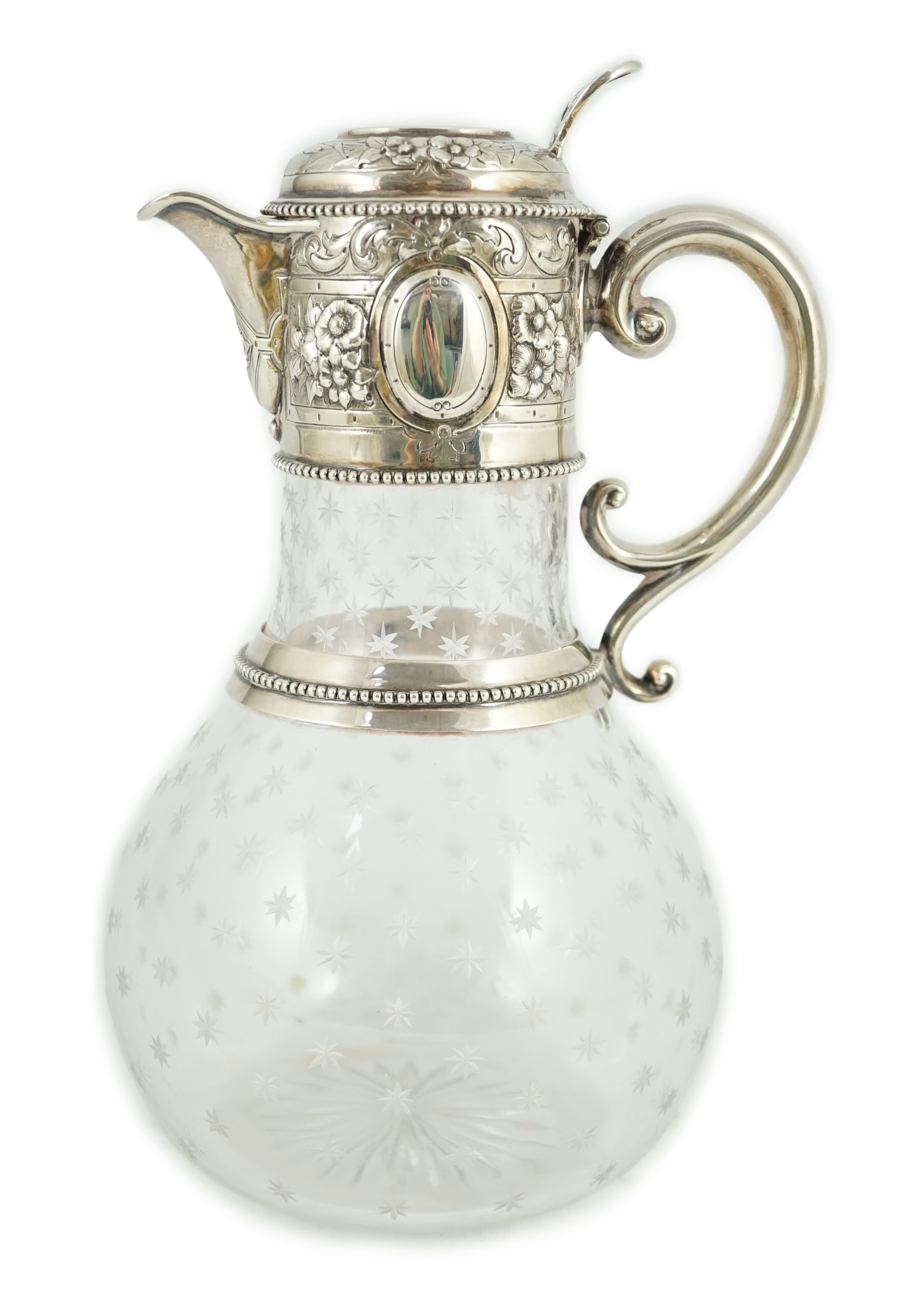 A Victorian embossed silver mounted engraved glass claret jug, the glass later, the silver, Sheffield, 1868, by William and George Sissons